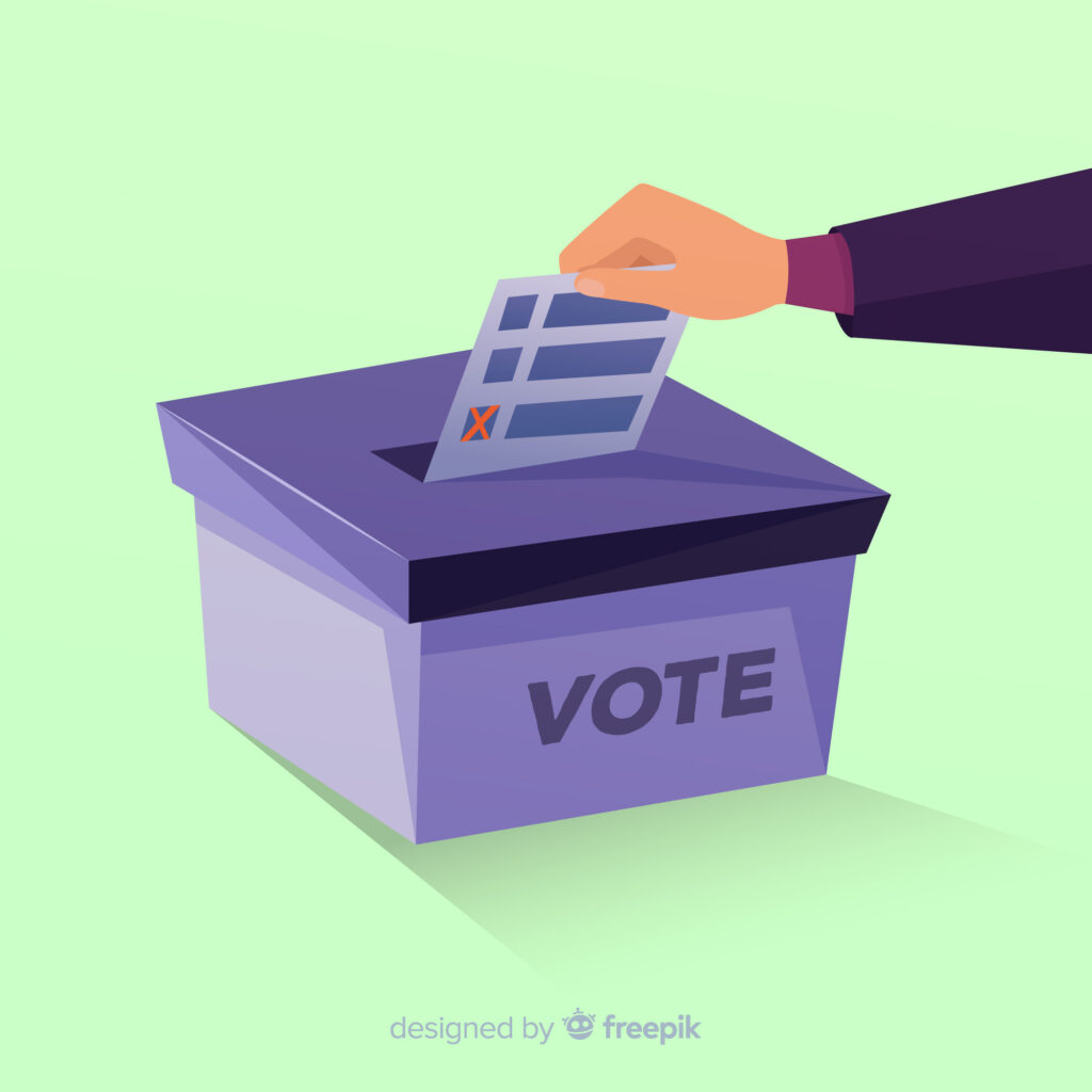 A imagem apresenta uma cédula de votação sendo depositada em um urna de votação. Nela está escrito "vote"