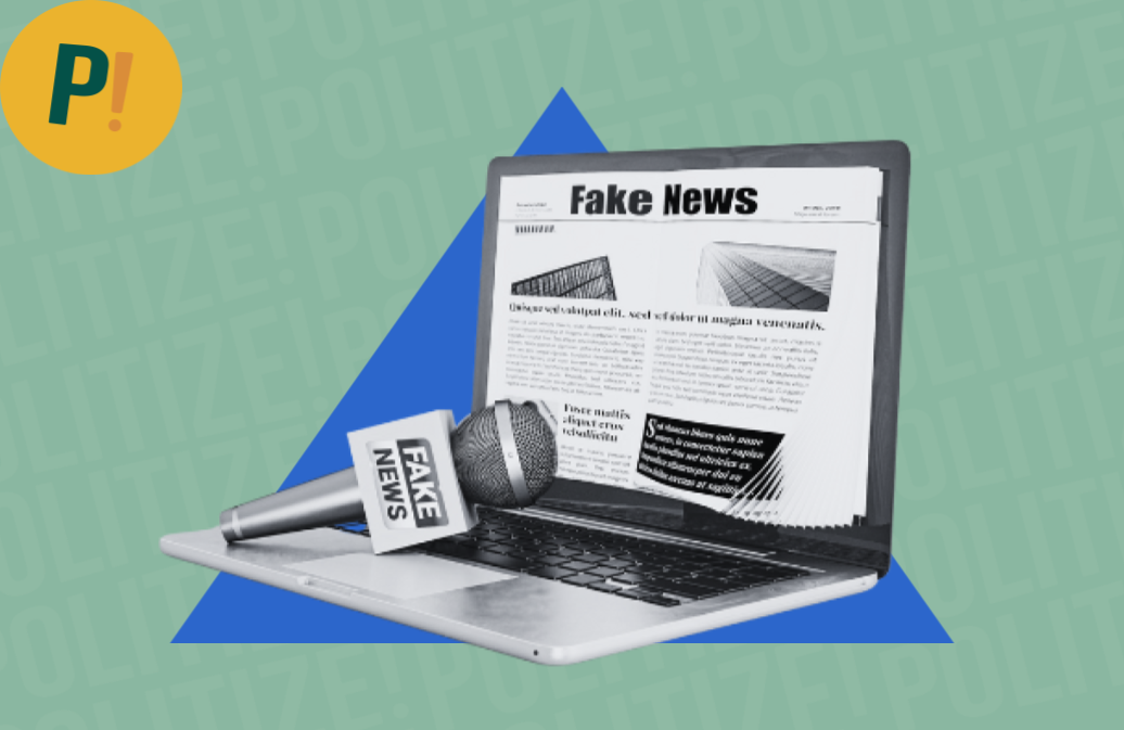 Computador e microfone de repórter com a escrita "fake news"