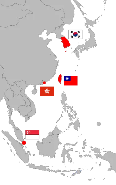 Na imagem, um recorte da área "asiática" do mapa mundi, e nele estão destacadas as quatro bandeiras dos países que compõem os Tigres Asiáticos.