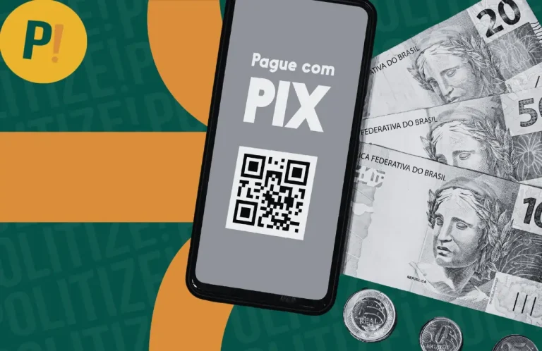 Imagem de um celular com PIX escrito e um QR code, ao lado de notas de real e moedas